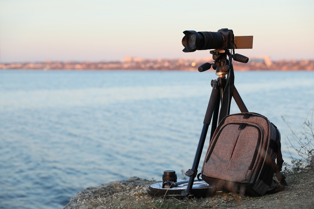 camera and backpack on rocky cliff overlooking wat 2026 09 22 01 11 12 utc