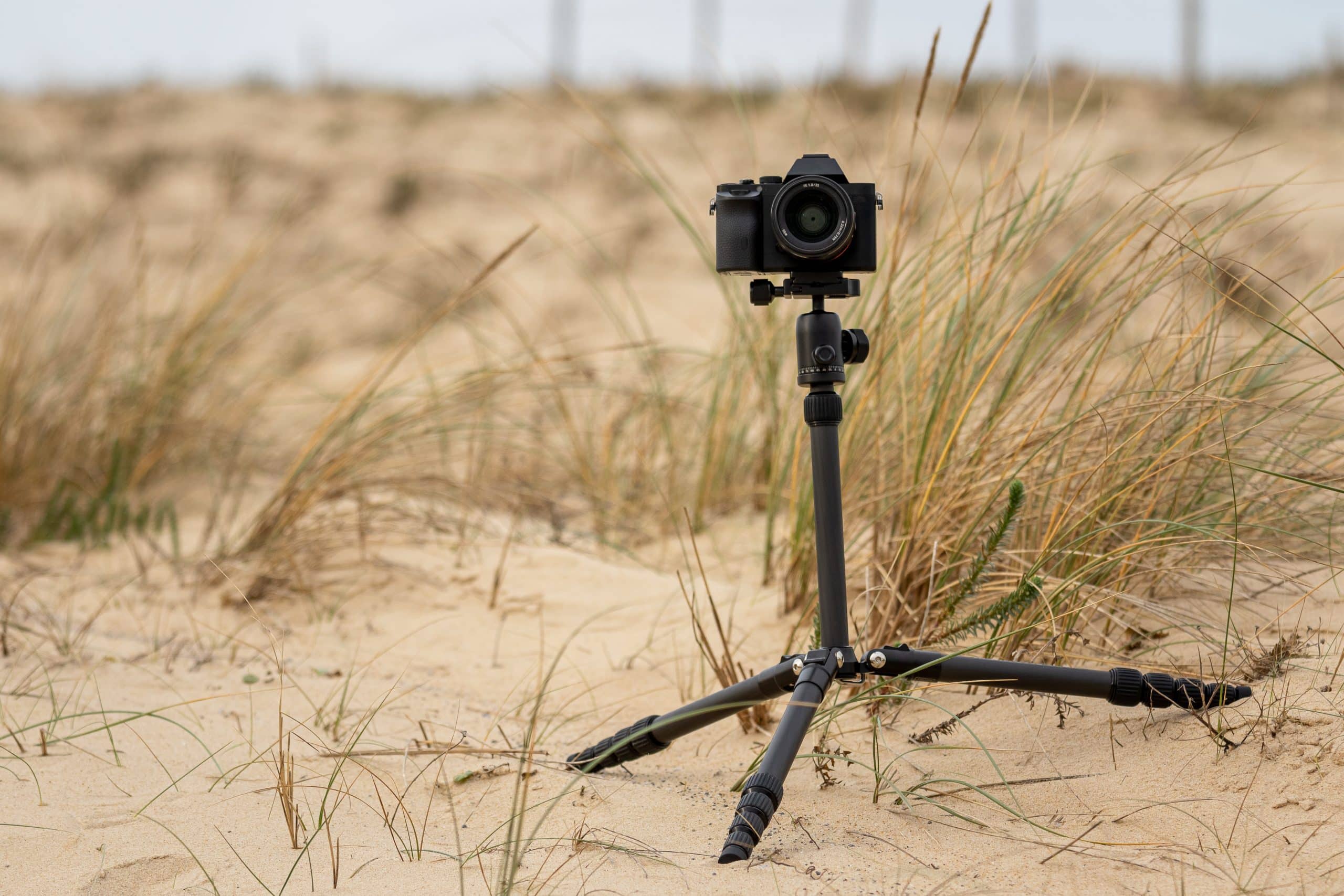 camera and tripod on a sandy beach 2026 09 21 14 05 52 utc scaled
