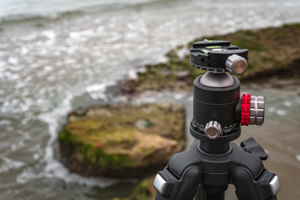 camera tripod on a rocky shoreline near ocean 2026 09 23 13 06 56 utc